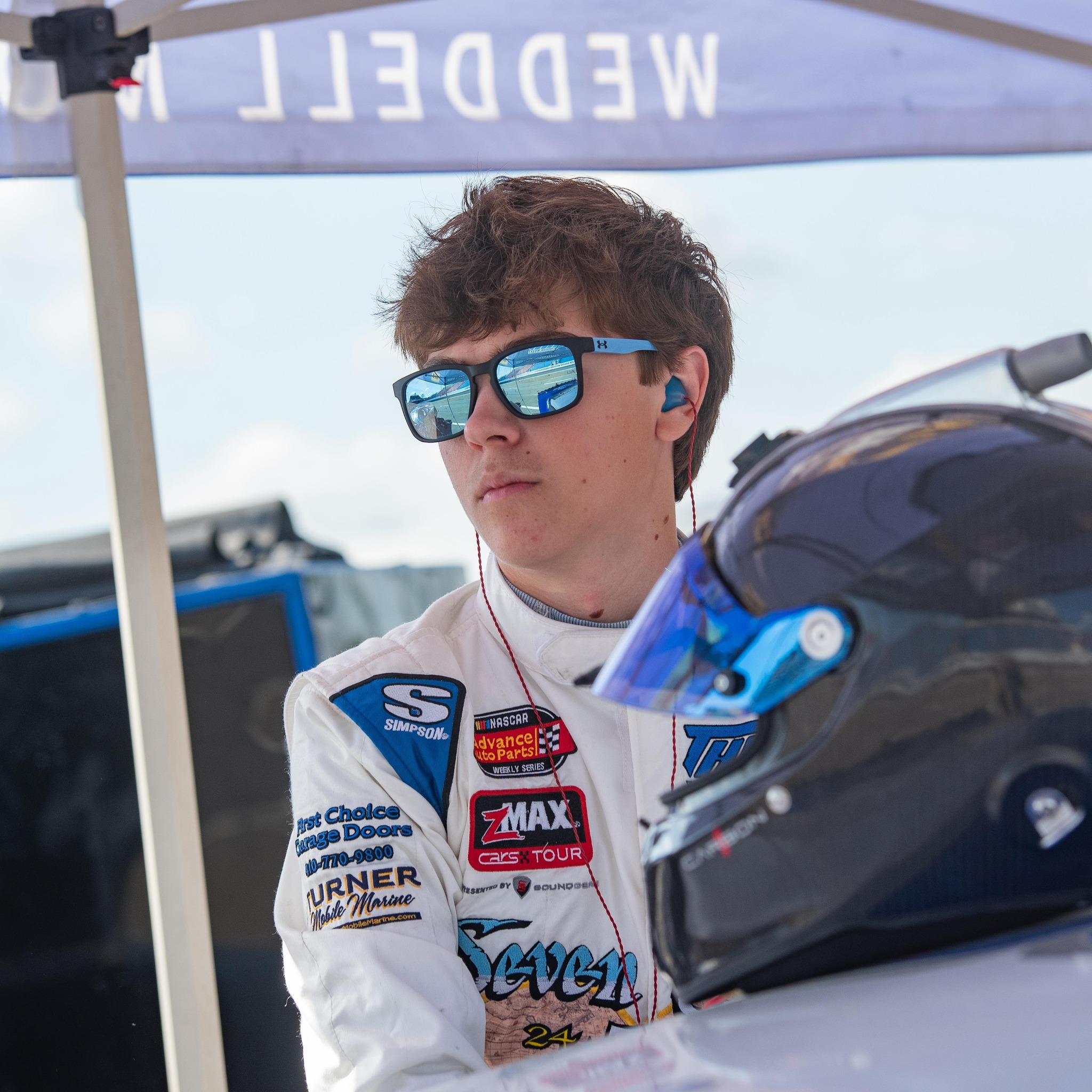 Conner Weddell under the Weddell Motorsports tent before a race
